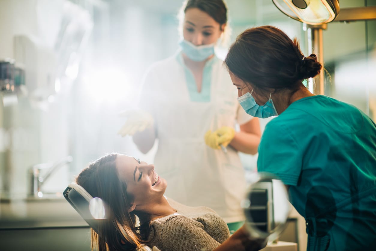 Patient speaking with a dentist before a procedure
