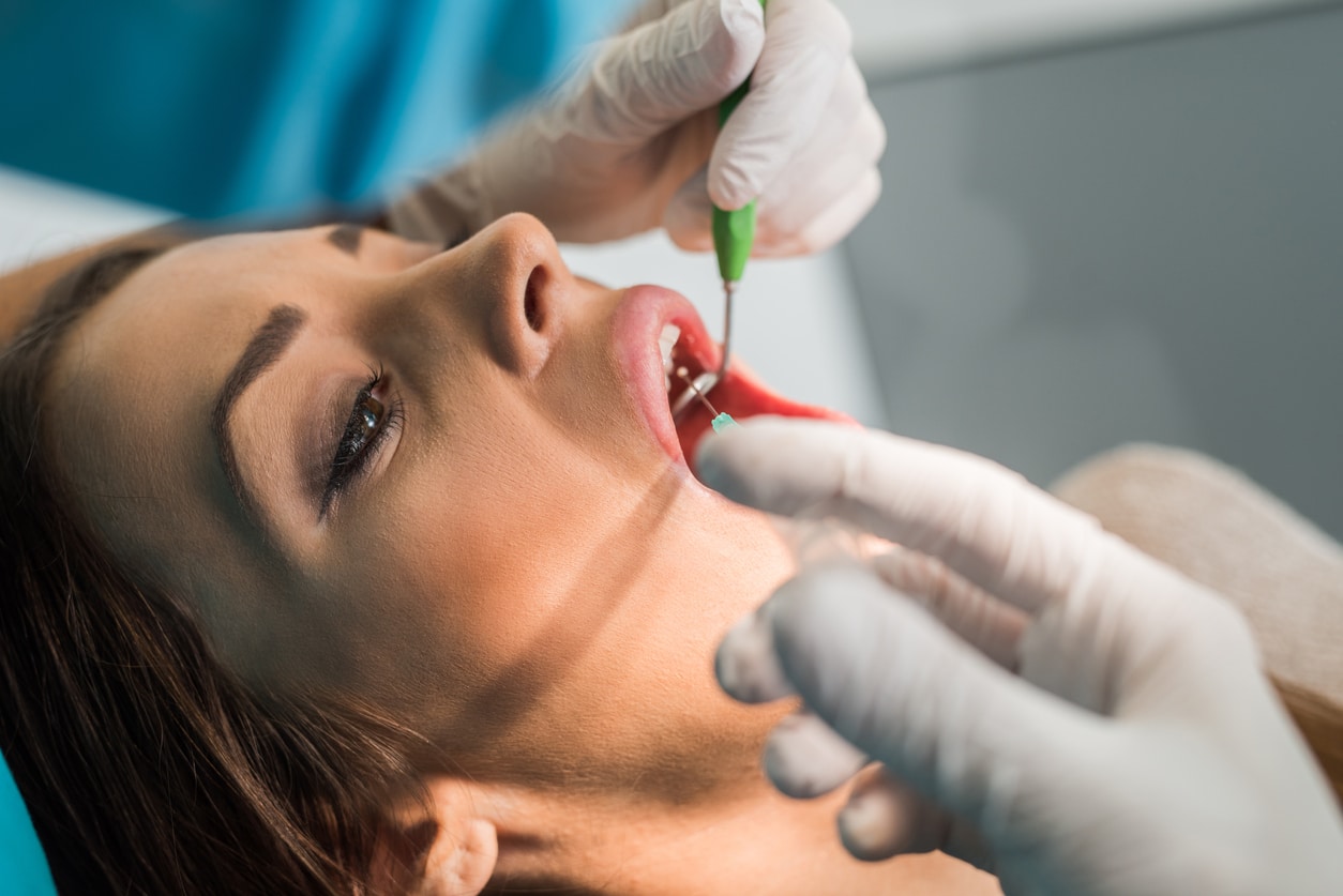 Patient receiving local anesthetic before a dental procedure